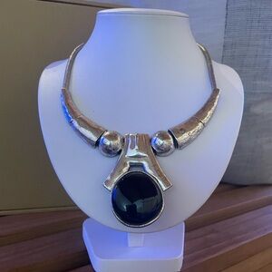 Silver necklace with large black stone